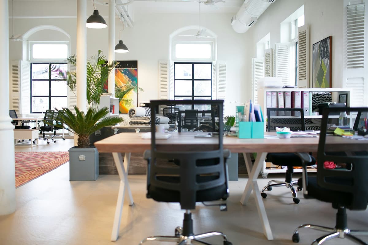 Bright office with tall arched mill-style windows and freshly painted white walls in Belper